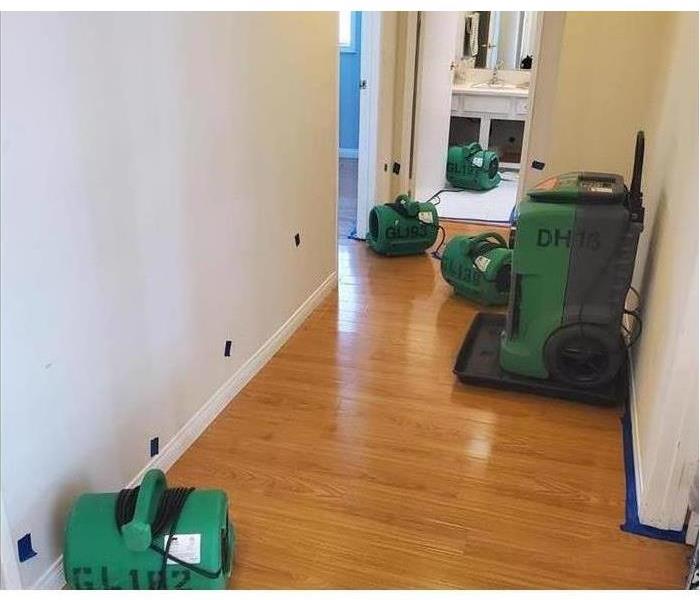 Hallways with air movers and dehumidifiers. 