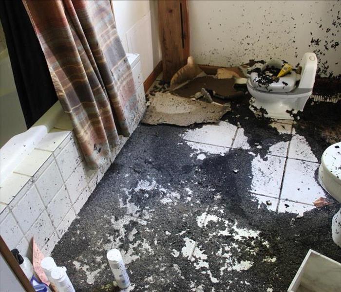 Soot damaged bathroom floor.
