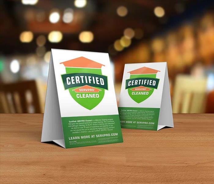 Certified:SERVPRO Cleaned table toppers on table inside business